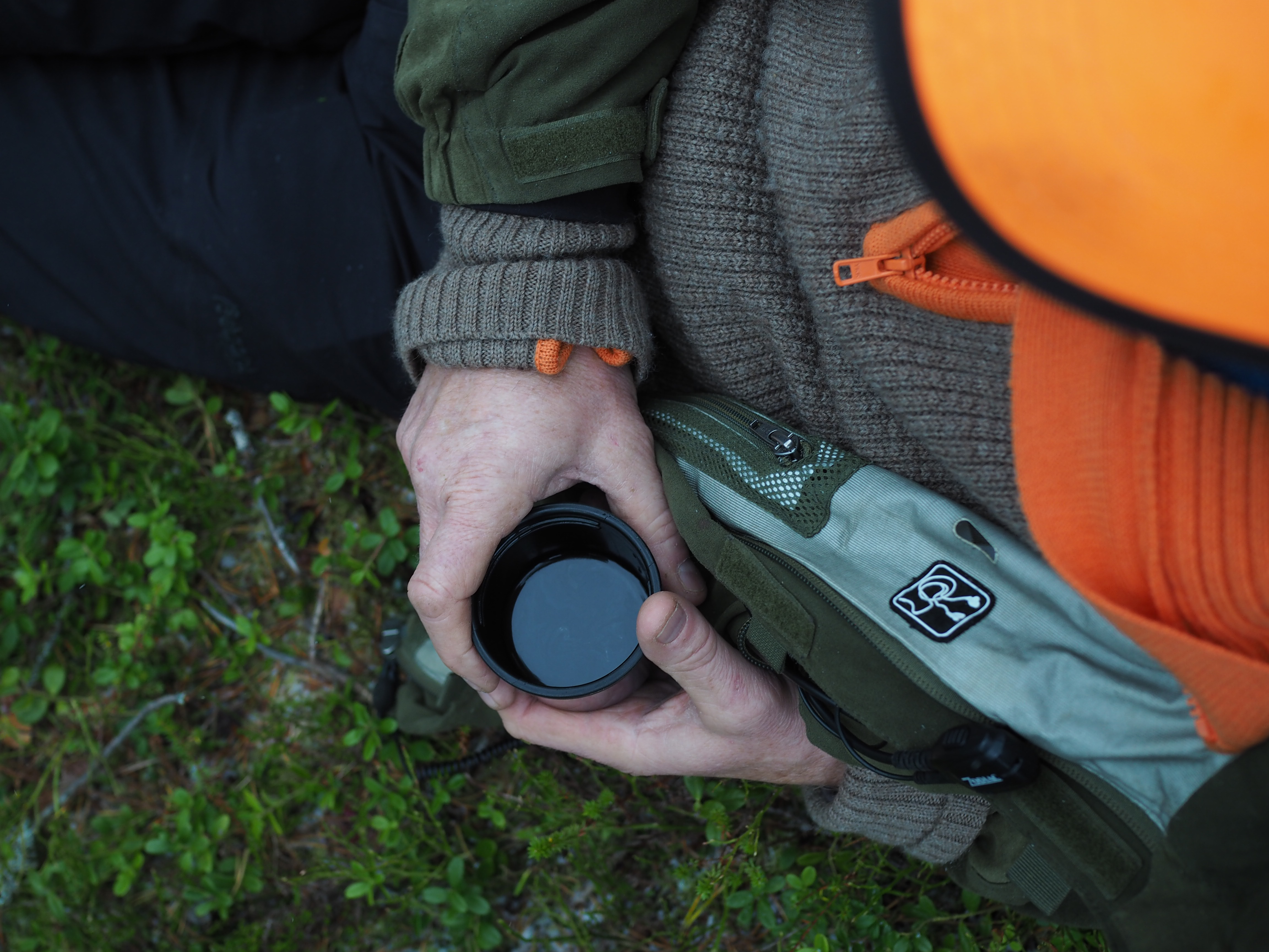 The first flurries of snow trickled from the sky. Not far from the dirt road, nestled in the bush and looking intently into the orange and yellow flames of the makeshift campfire, sat Team Traaen. Olav, Knut Halvor, Mathias and Ole quietly engaging in conversation and a light meal as they warmed themselves by the fire. Following friendly greetings and an introduction, Olav Olav shows me the strap on his rifle and points out how the seams are coming apart. He supposes it will soon be time to replace it, but it holds a special place as this was his father’s which was given to him. He accepts that nowadays the younger hunters desire the latest gadgets and styles, but there is something significant in what has been passed down. The family team was formed in 1931 by the father and uncle of Even Traen. Even’s uncle shot his very first moose that year despite never seeing one before. It is said that is was possibly the only one shot in Rollag that year. A good omen, quite possibly. The hunt is therefore very special and has played an important role throughout many generations, especially in this region.