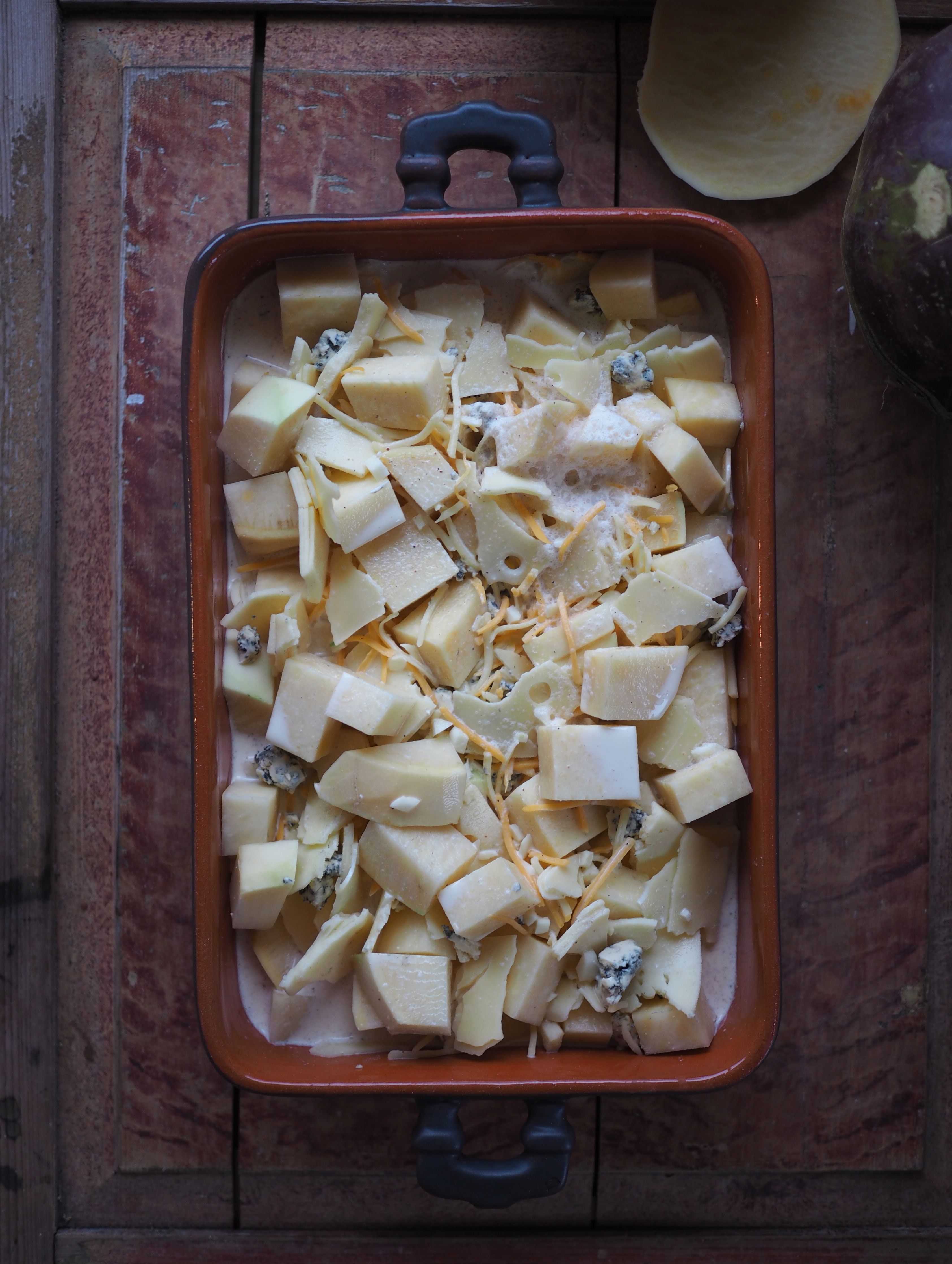 Cheesy Rutabaga & Beer Bake served with Vinegary Greens, Toasted Mustard Seeds and Horseradish