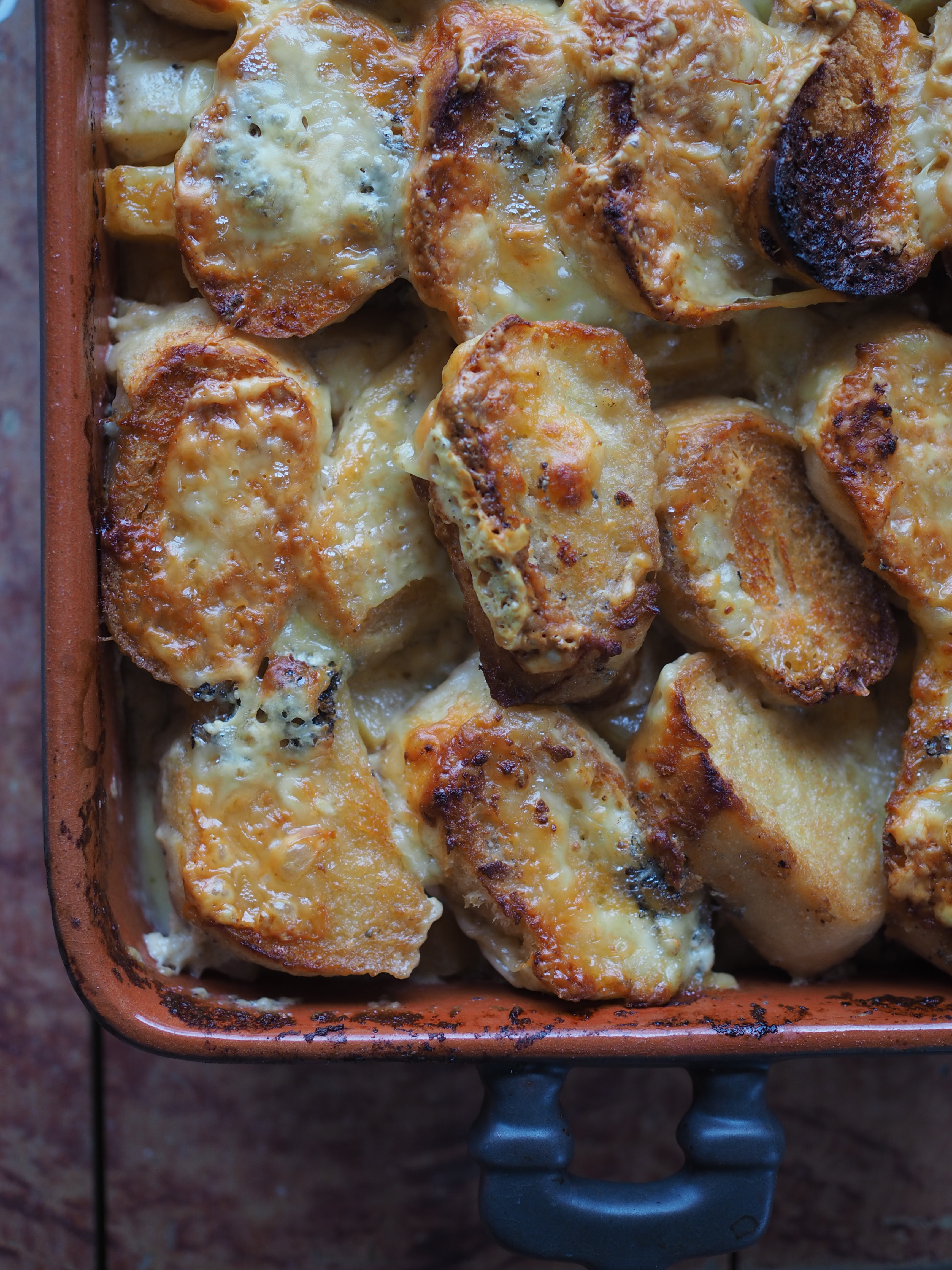 Cheesy Rutabaga & Beer Bake served with Vinegary Greens, Toasted Mustard Seeds and Horseradish