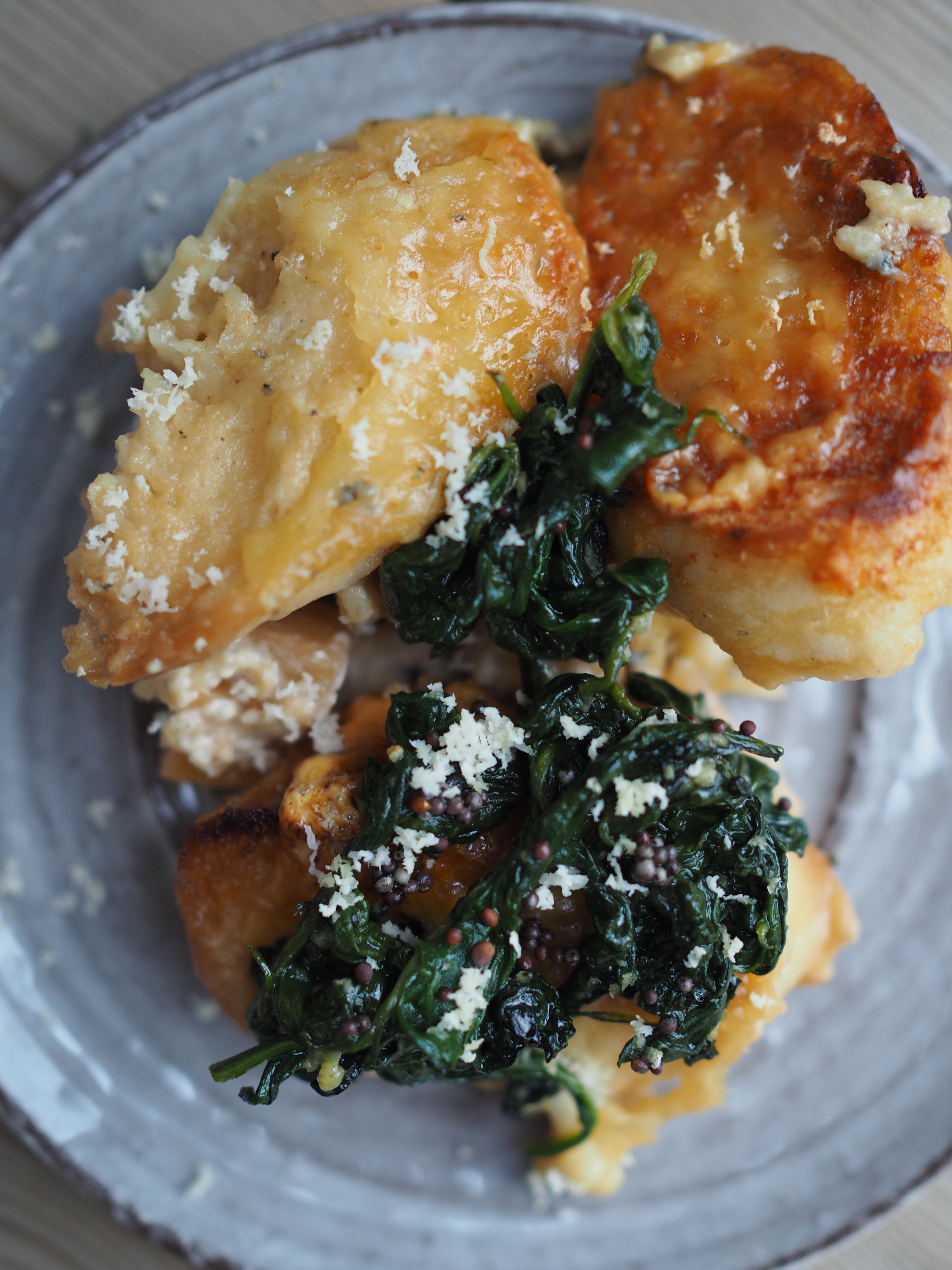 Cheesy Rutabaga & Beer Bake served with Vinegary Greens, Toasted Mustard Seeds and Horseradish