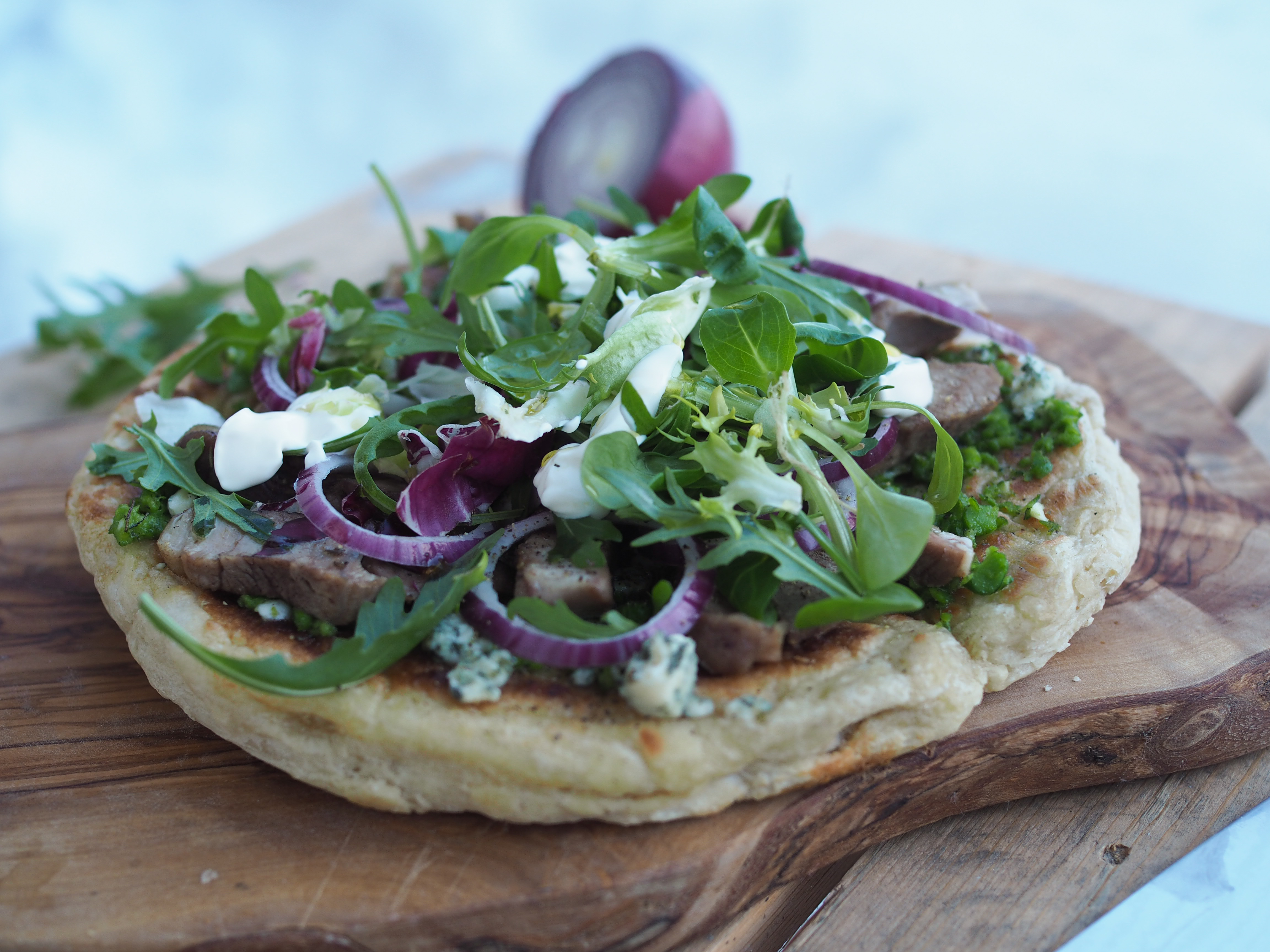 Outdoor Skillet Pizza with Lamb and Pea Pesto